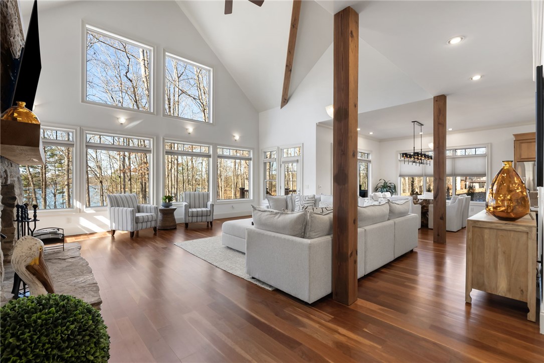 505 Northview Court Fair Play, SC 29643 - Photo 17 of 48 This living room offers expansive windows, a fireplace, and hardwood floors for comfortable gatherings.