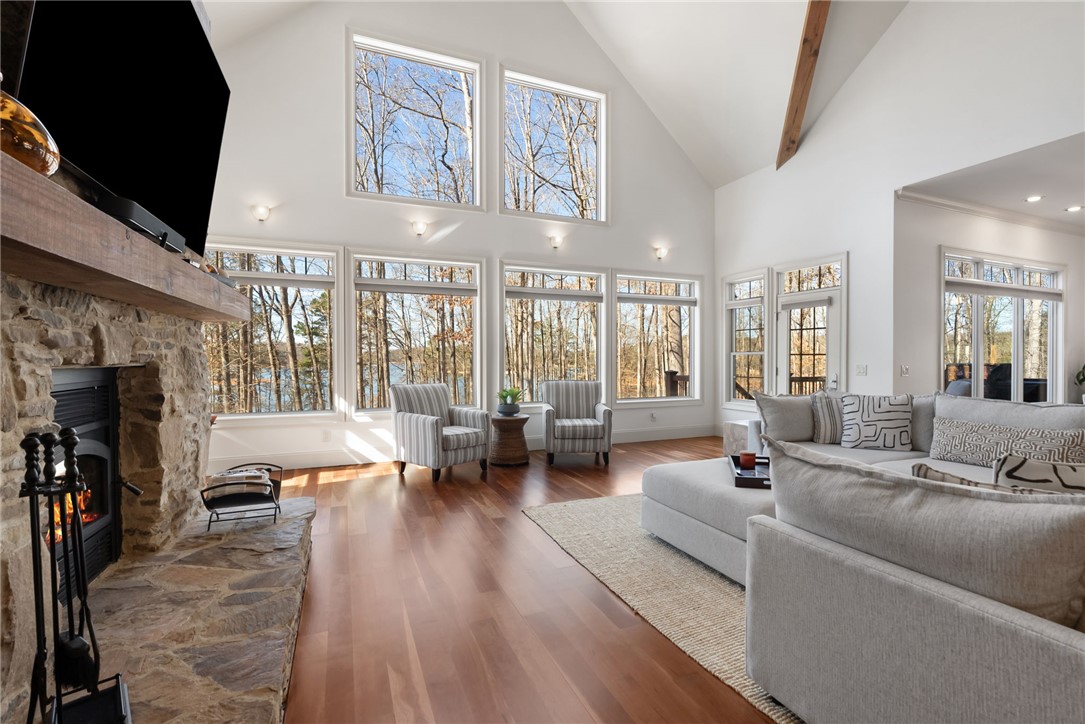505 Northview Court Fair Play, SC 29643 - Photo 18 of 48 This airy living space features a cozy fireplace and expansive windows with serene views.