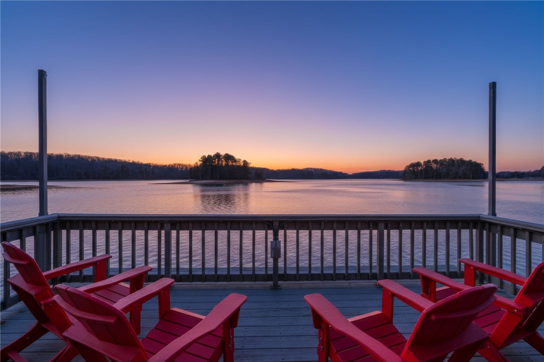 505 Northview Court Fair Play, SC 29643 - Photo 2 of 48 This pier offers a serene waterside retreat with expansive lake views at sunset.