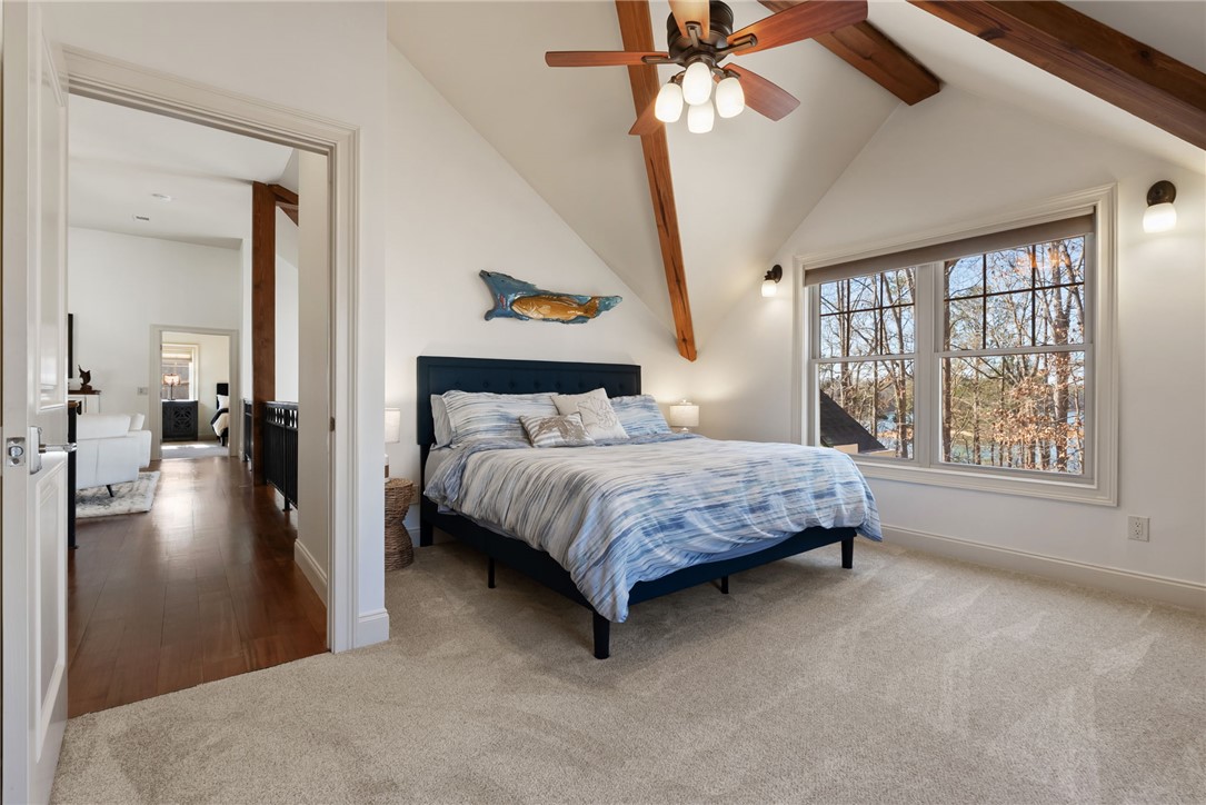 505 Northview Court Fair Play, SC 29643 - Photo 29 of 48 This airy bedroom features high vaulted ceilings, warm wood beams, and a scenic window view.
