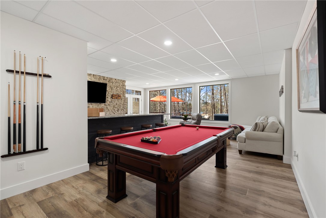 505 Northview Court Fair Play, SC 29643 - Photo 34 of 48 This versatile recreation room offers entertainment and relaxation, seamlessly blending indoor comfort with outdoor views.