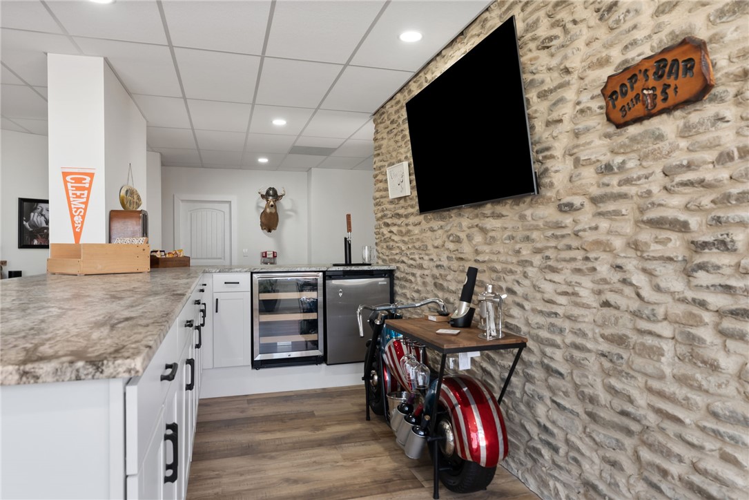 505 Northview Court Fair Play, SC 29643 - Photo 36 of 48 This versatile basement features a stylish bar area with stone accents and a unique beverage station.