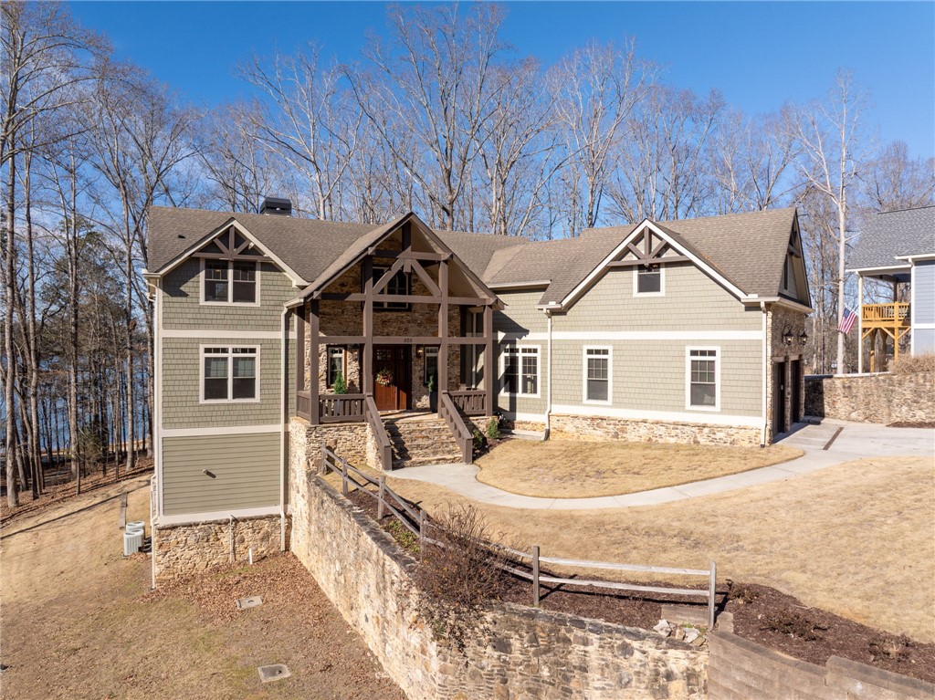 505 Northview Court Fair Play, SC 29643 - Photo 6 of 48 This captivating residence boasts a blend of natural materials and architectural charm, nestled within a picturesque landscape.