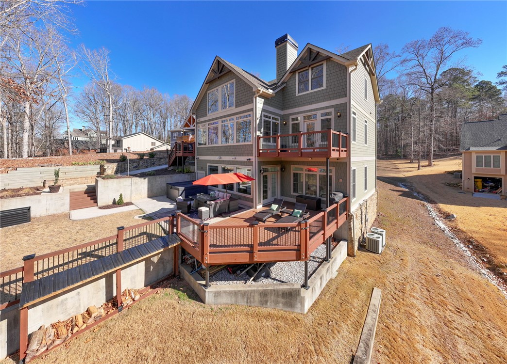 505 Northview Court Fair Play, SC 29643 - Photo 7 of 48 This house features a multi-level deck and an outdoor spa, perfect for outdoor entertainment.
