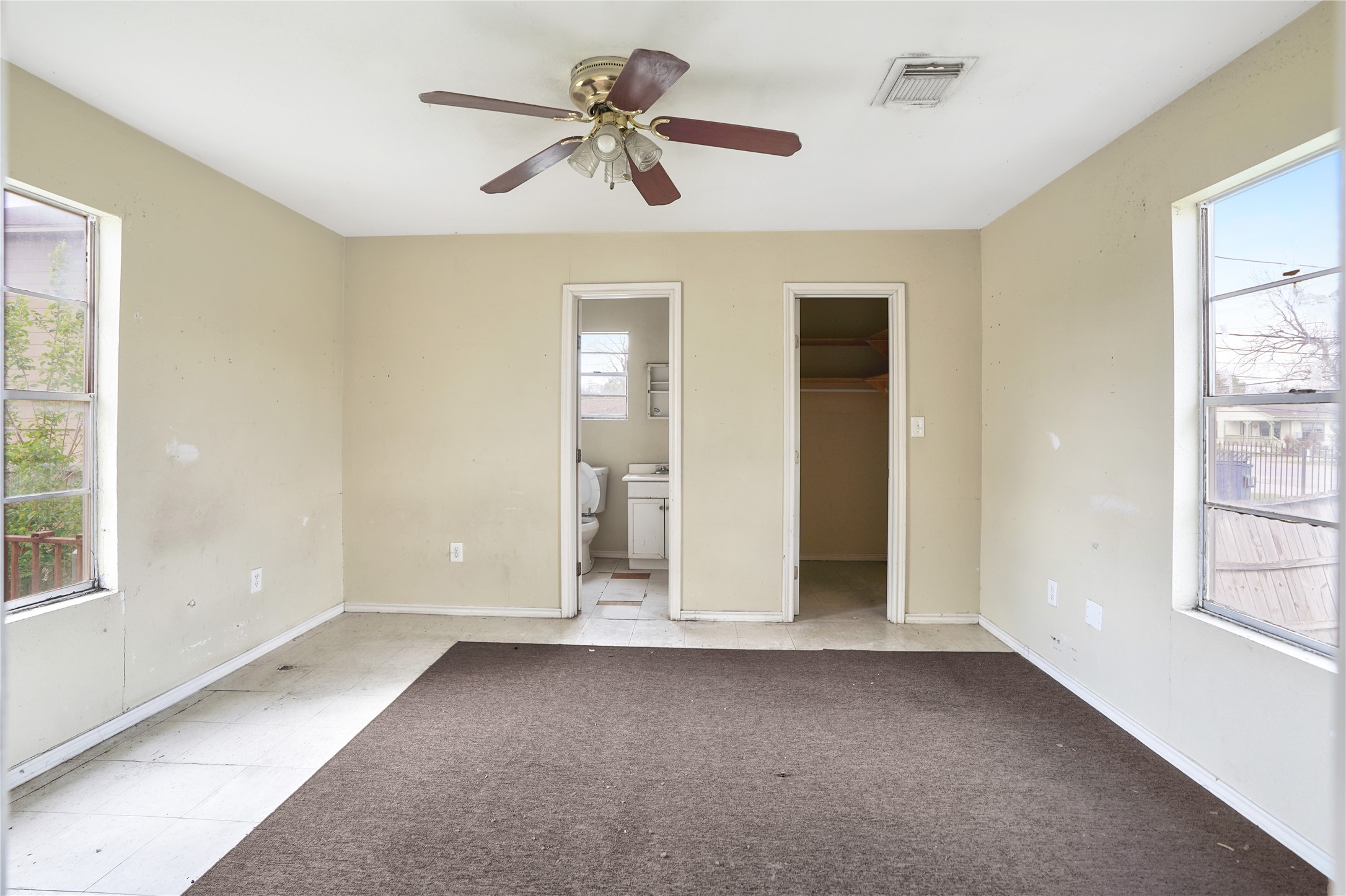 13301-13309 Reeveston Road Houston, TX 77039 - Photo 22 of 35 a view of room with a ceiling fan and window