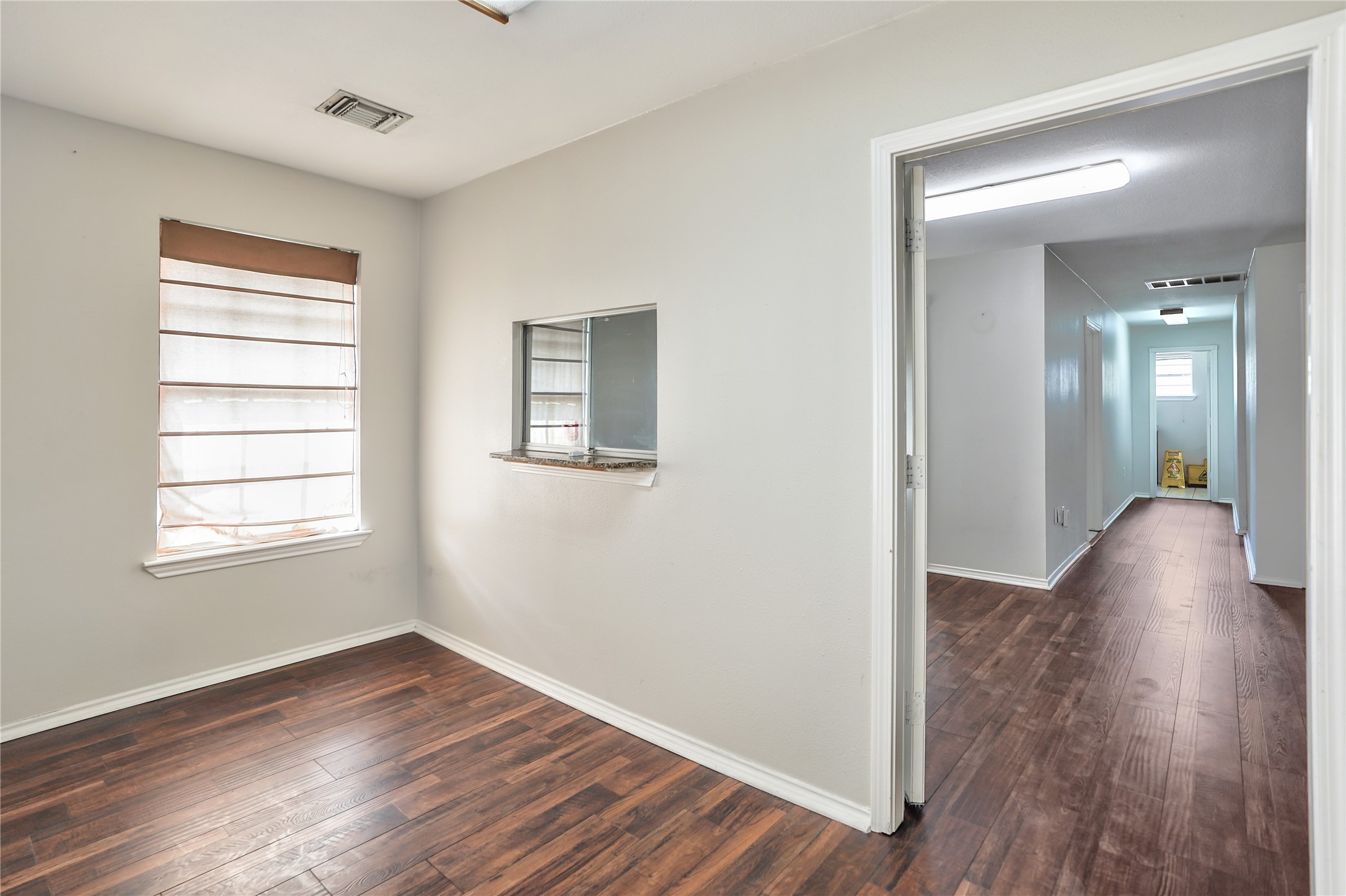 13301-13309 Reeveston Road Houston, TX 77039 - Photo 23 of 35 a view of livingroom with hardwood floor and window