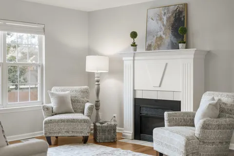 a living room with furniture and a table