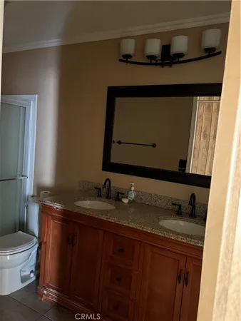 a view of a refrigerator in kitchen and a window
