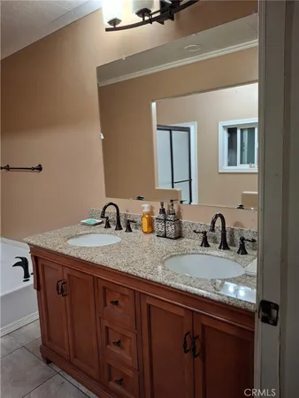 a white toilet sitting next to a bathroom sink