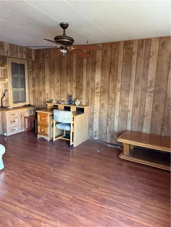 a view of a room with furniture window and wooden floor