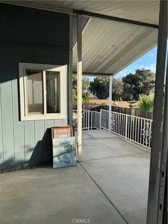 a view of a two chairs in the balcony