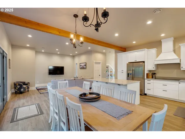 a kitchen with stainless steel appliances kitchen island granite countertop a sink counter space and cabinets