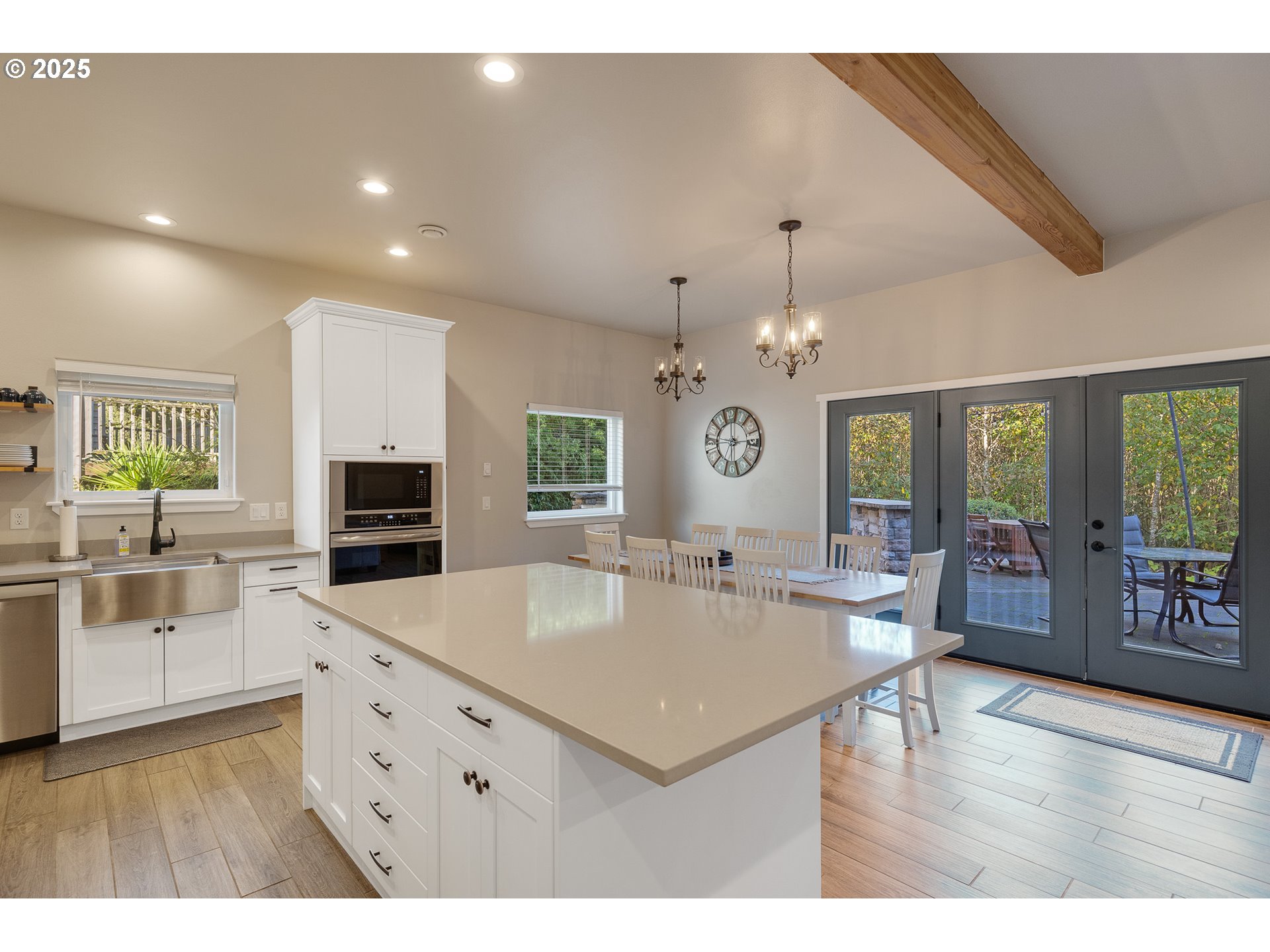 4380 Sequoia Loop Tillamook, OR 97141 - Photo 12 of 40 a kitchen with stainless steel appliances granite countertop a sink dishwasher and a stove with wooden floor