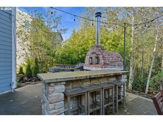 a table and chairs in front of a house
