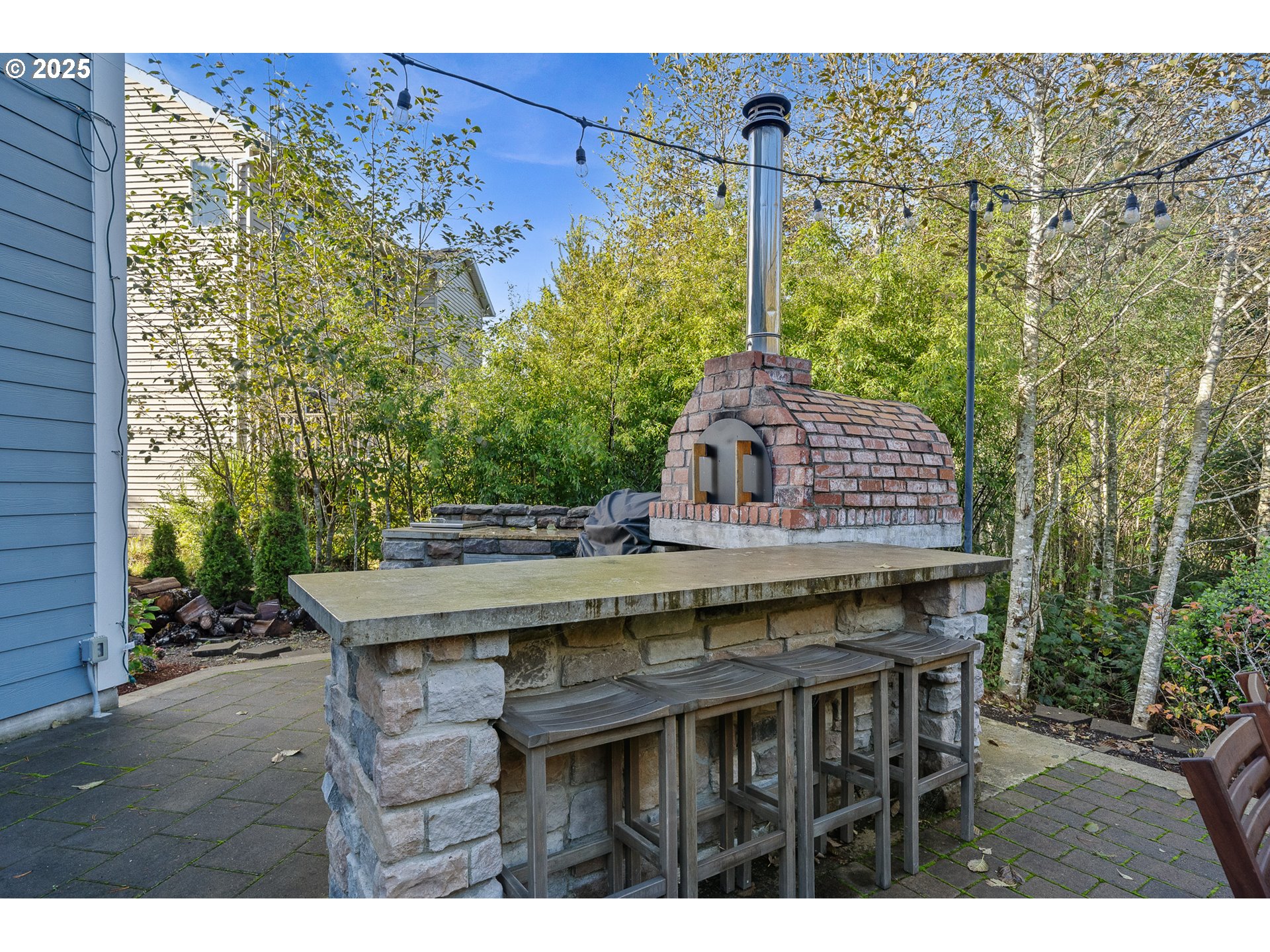4380 Sequoia Loop Tillamook, OR 97141 - Photo 16 of 40 a table and chairs in front of a house