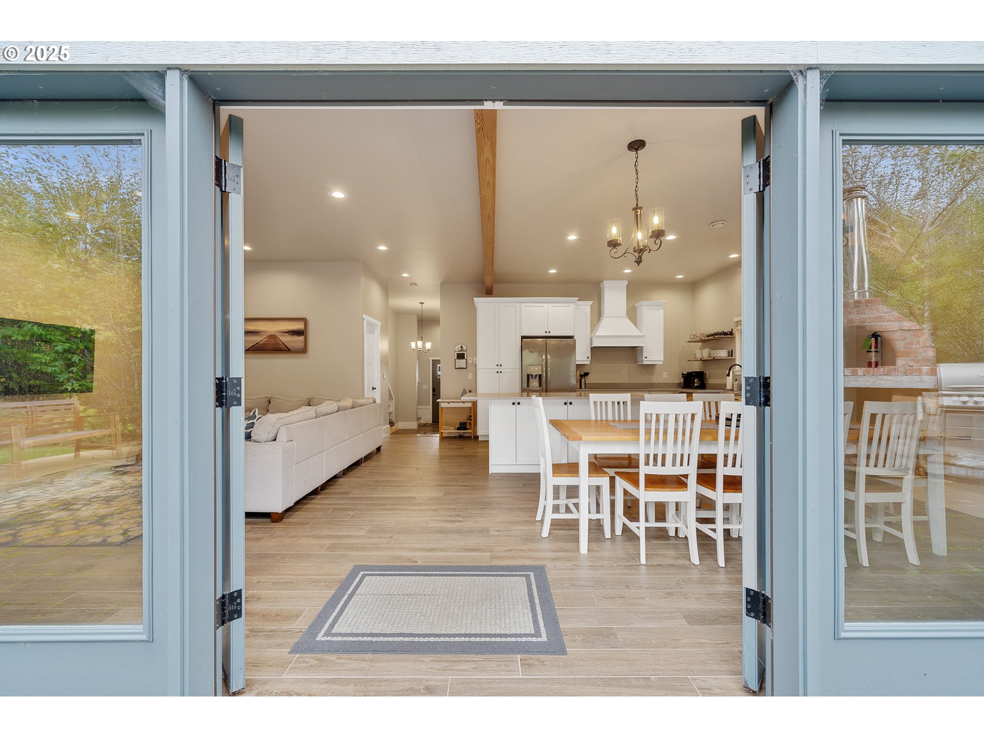 4380 Sequoia Loop Tillamook, OR 97141 - Photo 22 of 40 a dining room with wooden floor a glass table and chairs