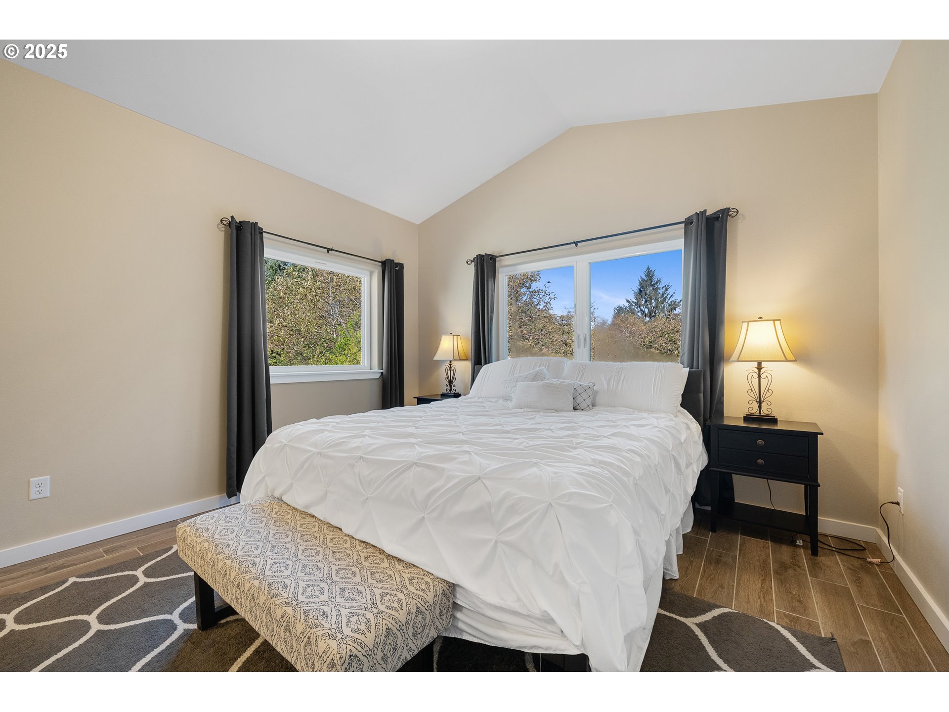 4380 Sequoia Loop Tillamook, OR 97141 - Photo 25 of 40 a bedroom with a bed and a painting on the wall