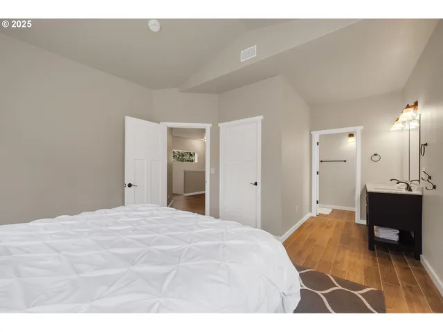 a bedroom with a bed and a table