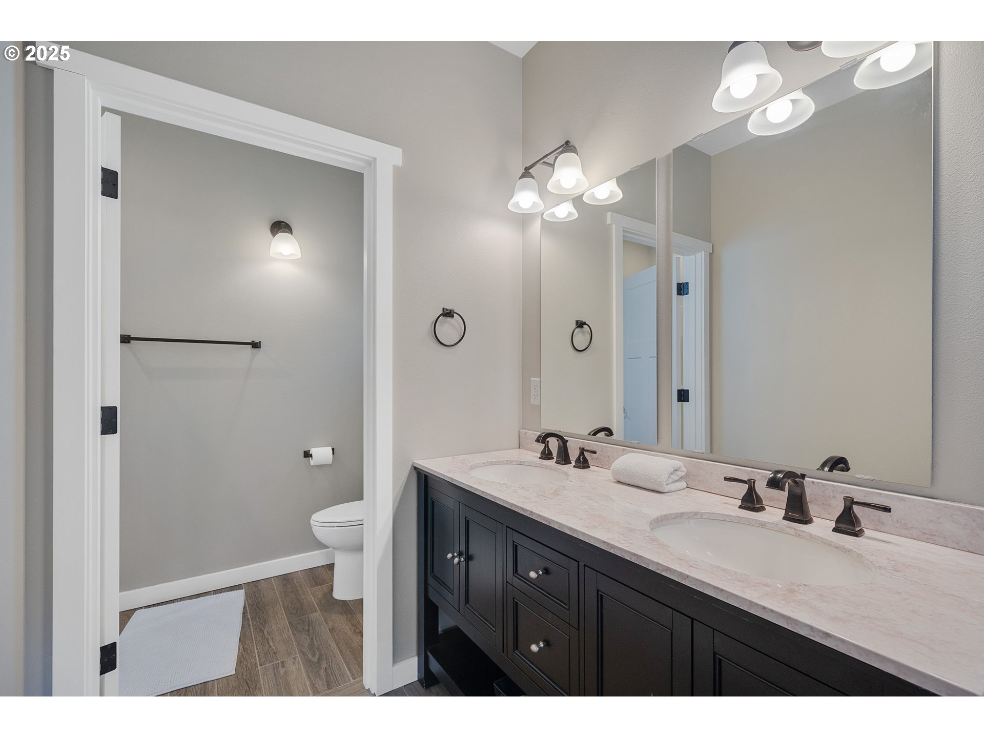 4380 Sequoia Loop Tillamook, OR 97141 - Photo 28 of 40 a bathroom with a double vanity sink mirror and toilet
