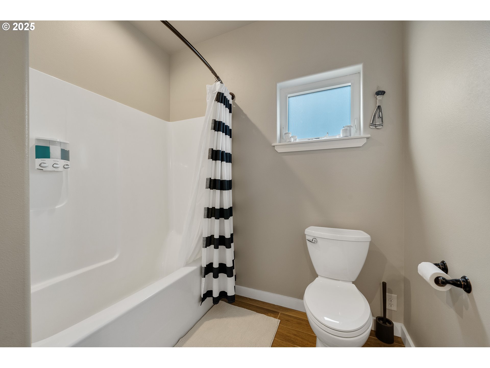 4380 Sequoia Loop Tillamook, OR 97141 - Photo 33 of 40 a bathroom with a toilet a sink and a shower