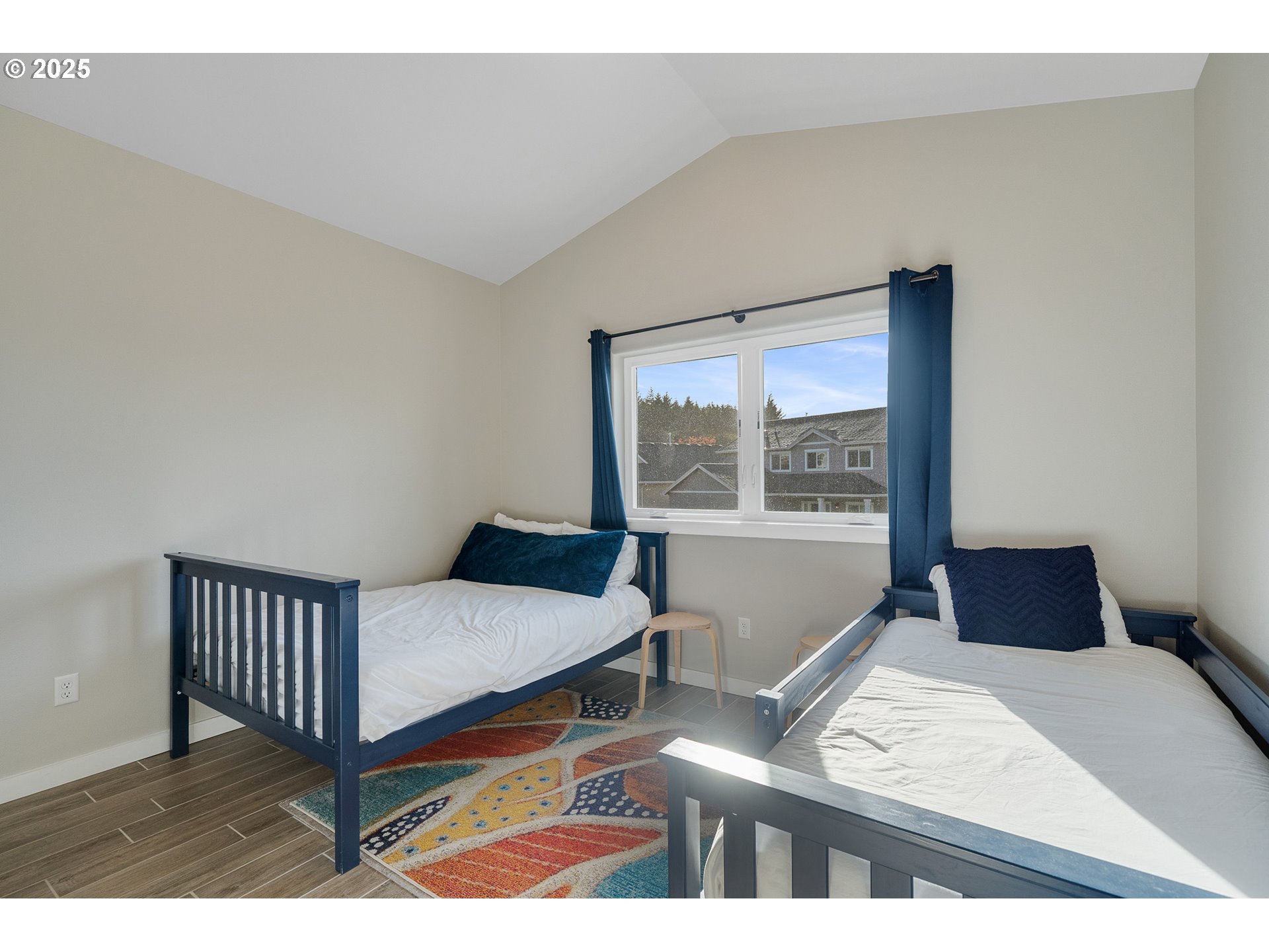 4380 Sequoia Loop Tillamook, OR 97141 - Photo 34 of 40 a bedroom with a bed and window