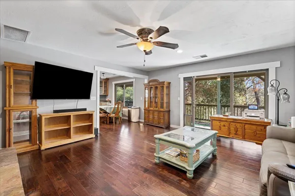 a kitchen with stainless steel appliances granite countertop a sink a stove and cabinets