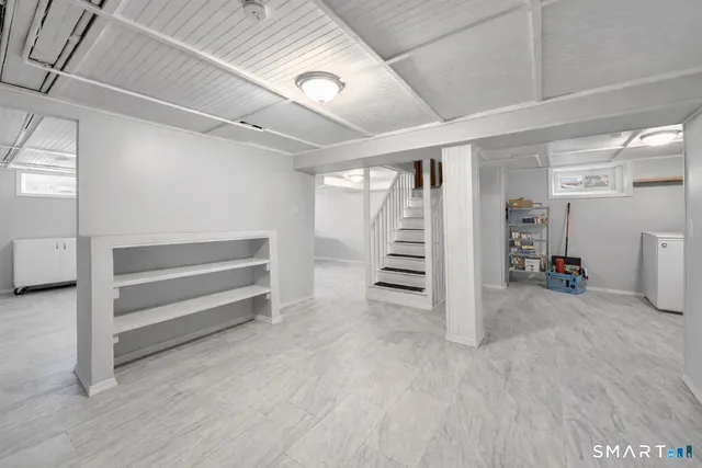 a view of an empty room with stairs