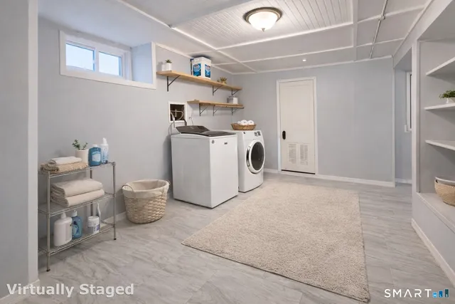 a view of a kitchen with white cabinets