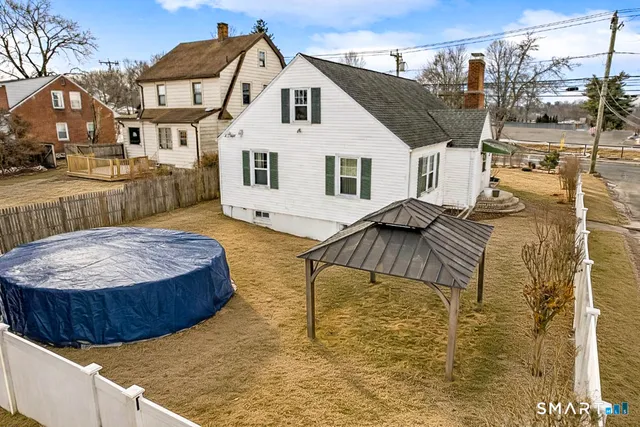 a view of a house with a sink and wooden floor