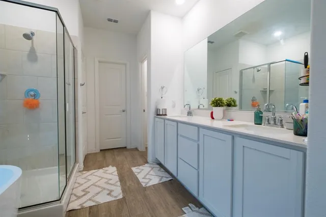 a bathroom with a sink and mirror
