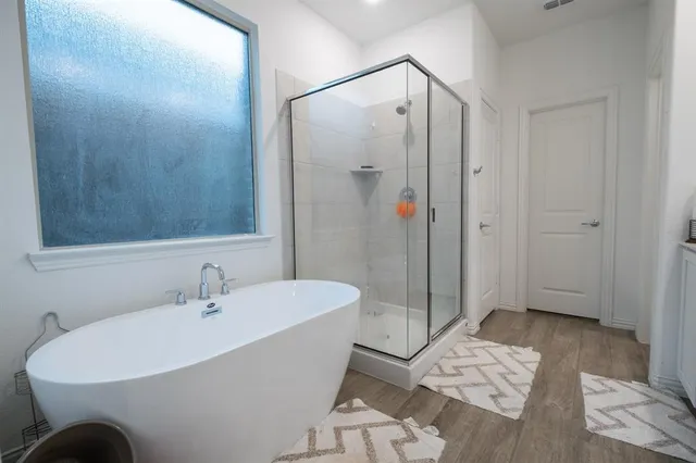 a white bath tub sitting next to a white sink