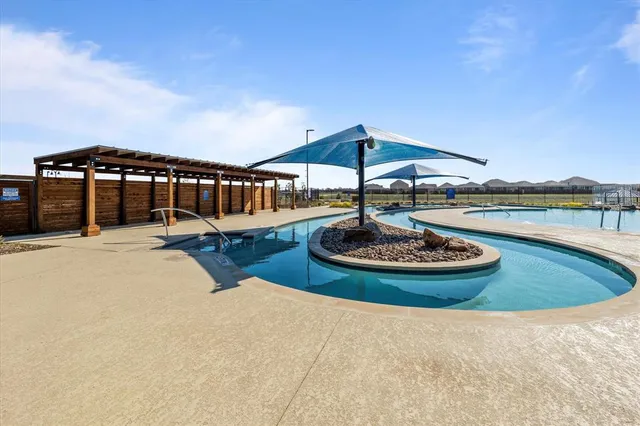 a view of a backyard with sitting area