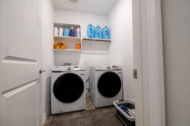 a utility room with dryer and washer