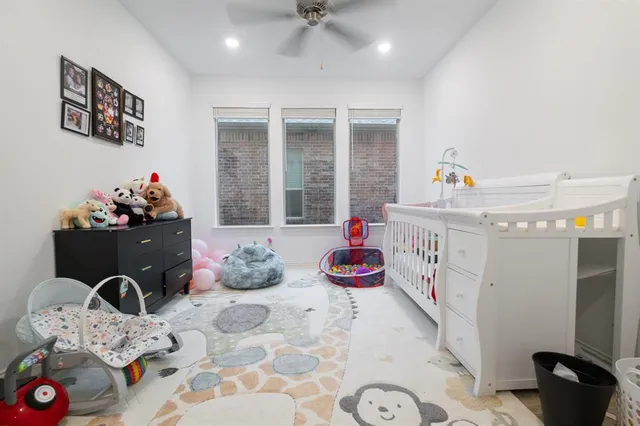 a kitchen with a refrigerator and a table