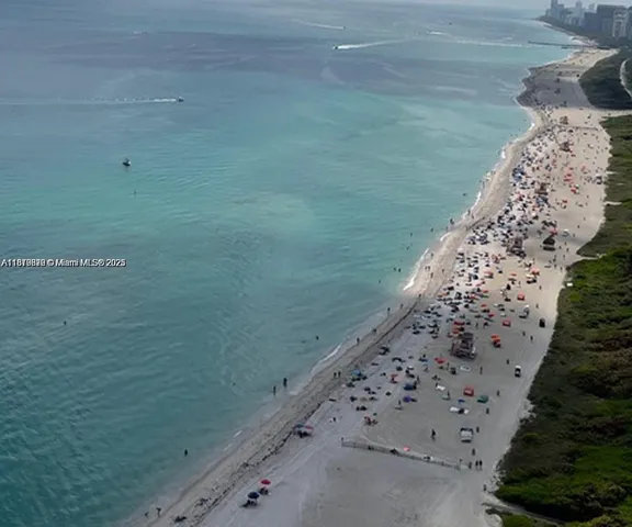 a bed room with a bed furniture and a refrigerator