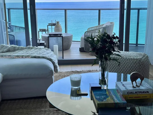 a living room with furniture flowerpot and window