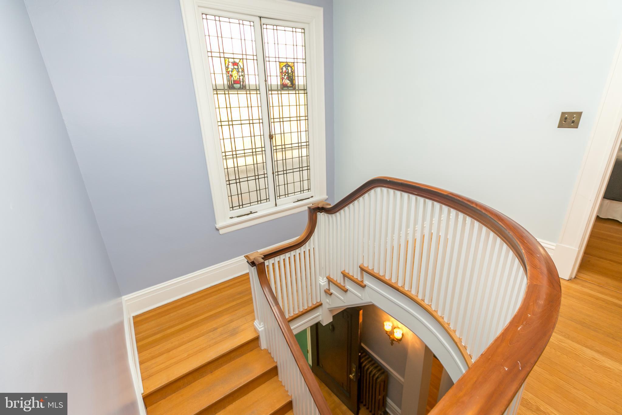 4828 Roland Avenue Baltimore, MD 21210 - Photo 22 of 50 Staircase & stained glass windows.