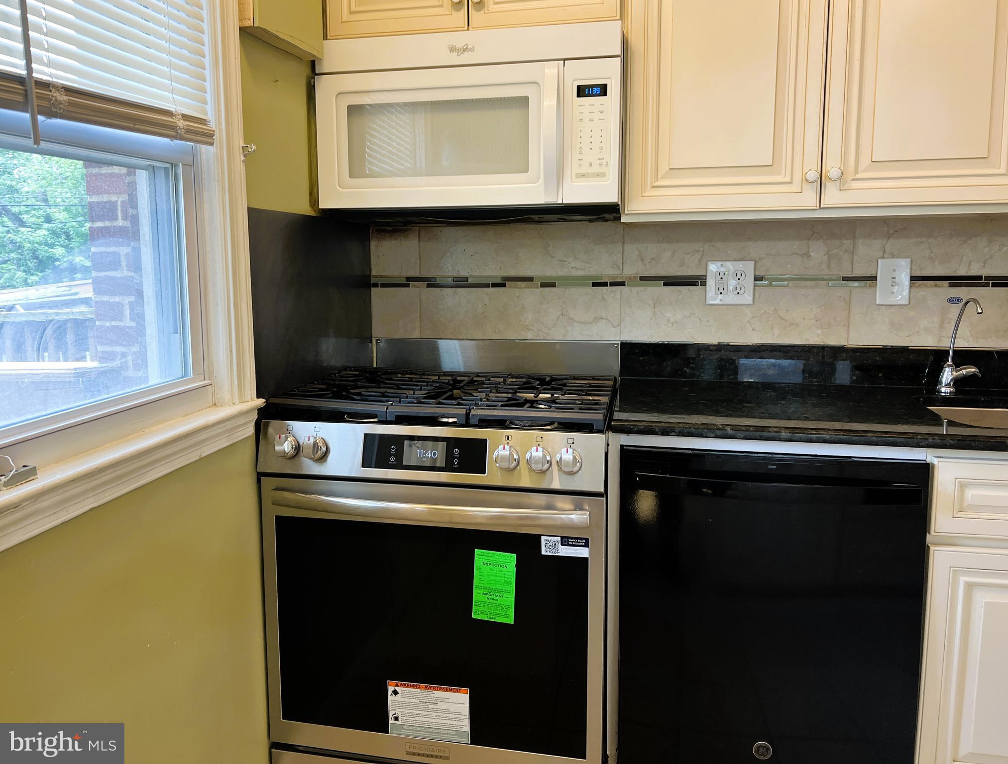 3705 Bancroft Road Baltimore, MD 21215 - Photo 7 of 50 a kitchen with cabinets and appliances