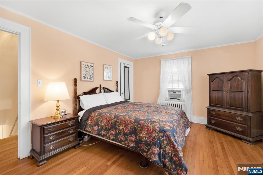 106 Maple Street Rutherford, NJ 07070 - Photo 29 of 50 a bedroom with a bed and a ceiling fan