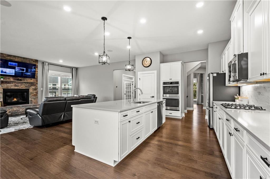 3031 Spruce Road Gibsonia, PA 15044 - Photo 23 of 49 a kitchen with stainless steel appliances kitchen island granite countertop a stove a sink and a refrigerator