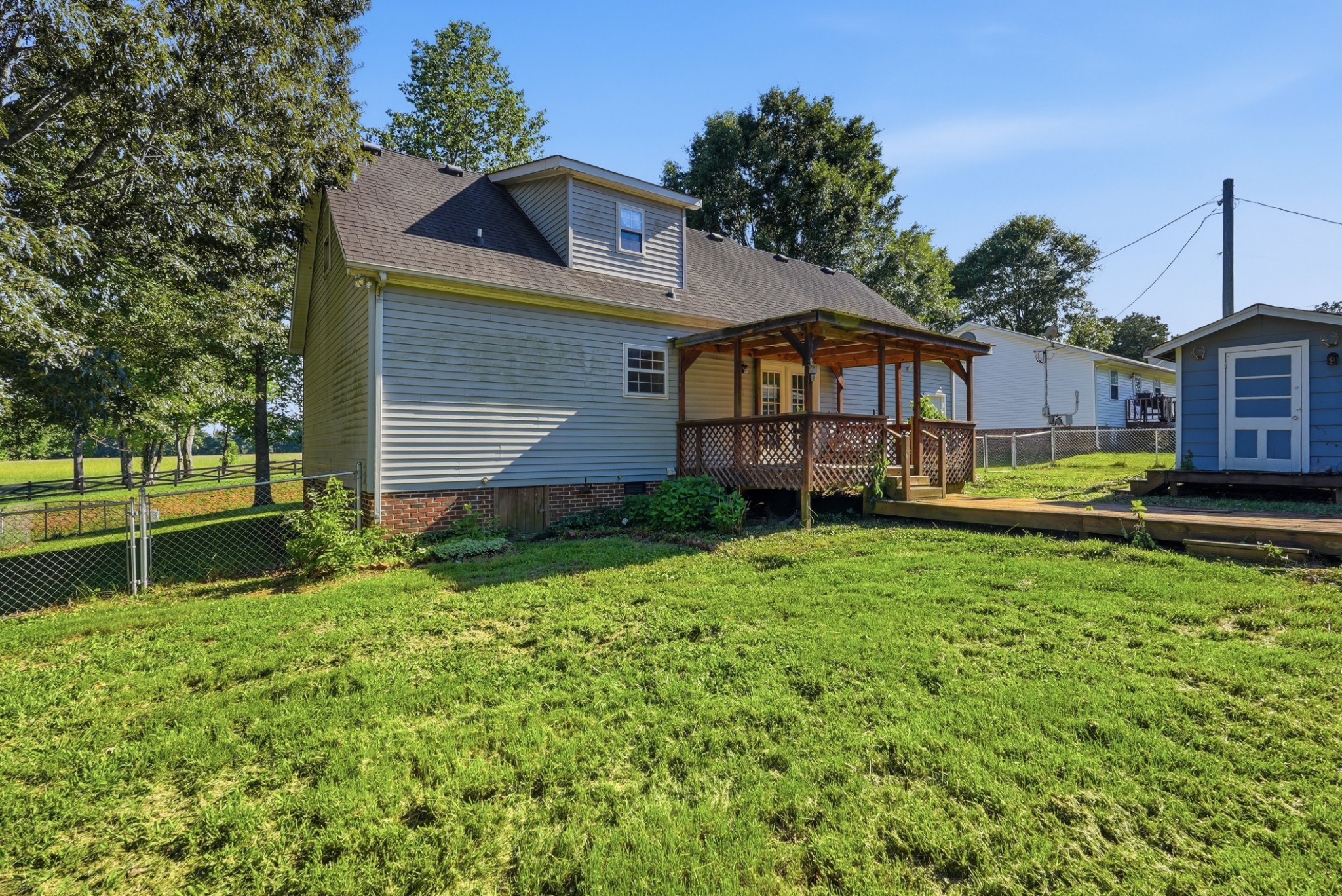4877 Swafford Road Cookeville, TN 38501 - Photo 6 of 28 a front view of a house with a yard