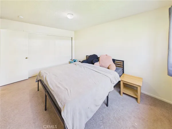 a view of a bedroom with closet area