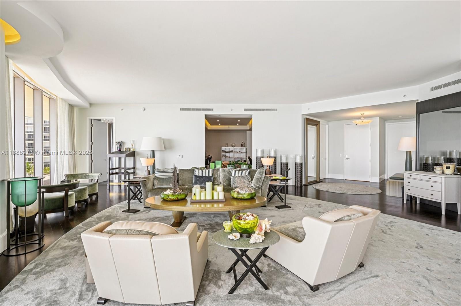 9703 Collins Avenue, Unit 600 Bal Harbour, FL 33154 - Photo 14 of 53 a living room with furniture and a large window