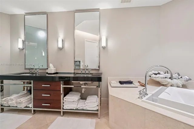 a bathroom with a granite countertop sink a toilet and bathtub