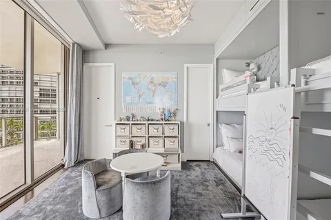 a bathroom with a double vanity sink toilet mirror and shower