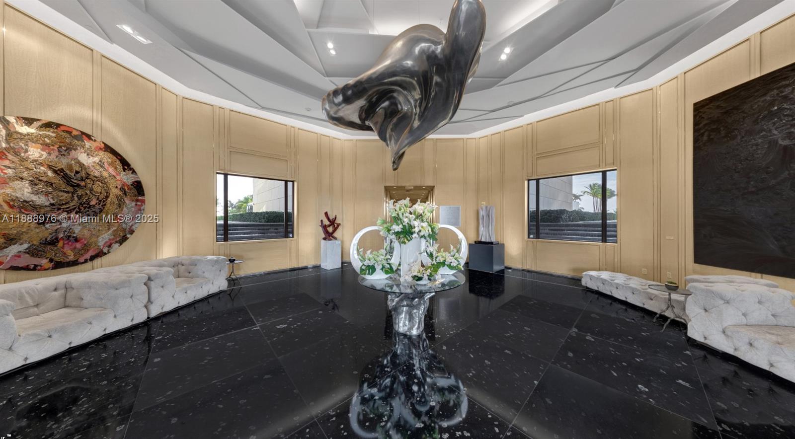 9703 Collins Avenue, Unit 600 Bal Harbour, FL 33154 - Photo 42 of 53 a vase of flowers sitting on a table