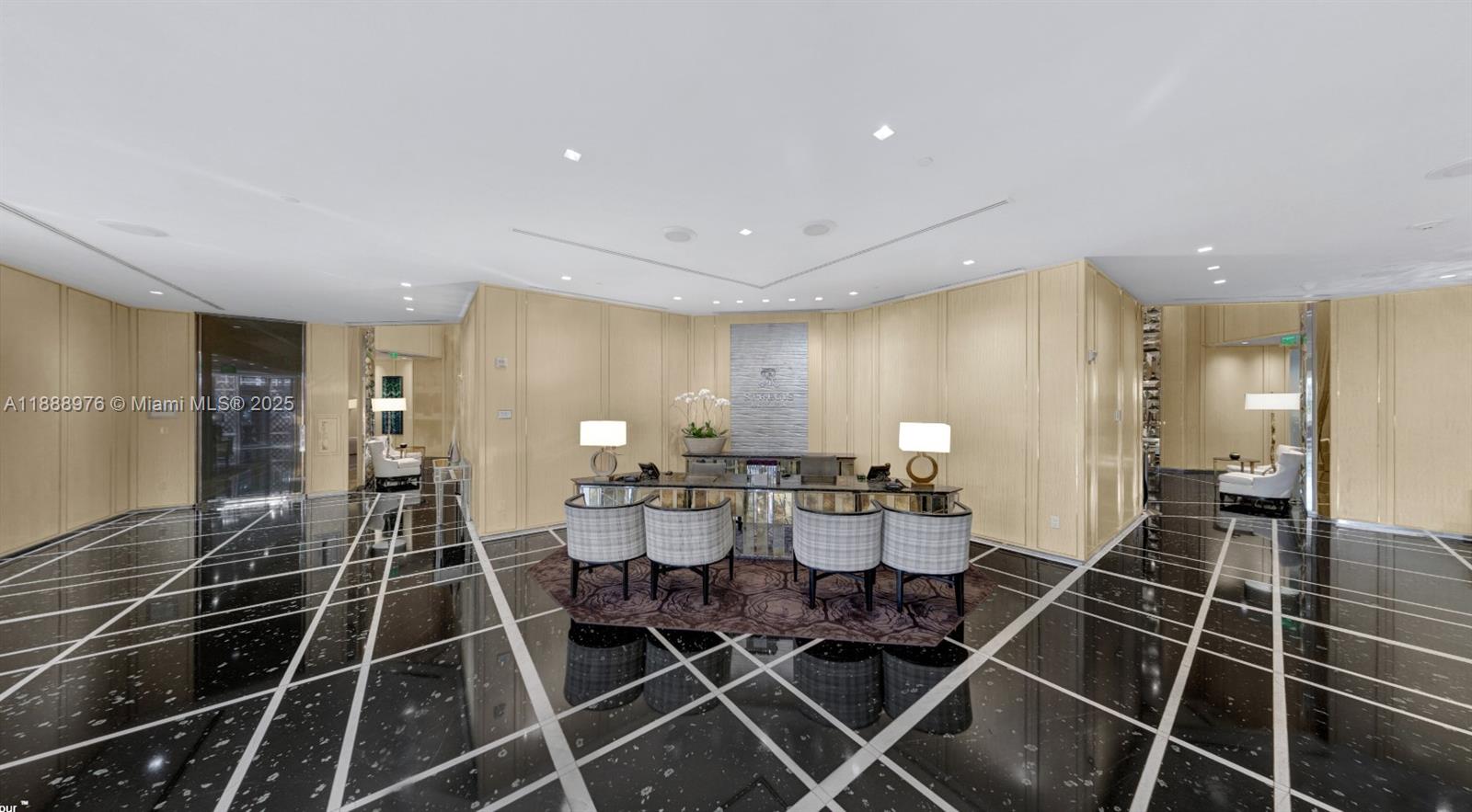 9703 Collins Avenue, Unit 600 Bal Harbour, FL 33154 - Photo 44 of 53 a kitchen with a dining table and chairs