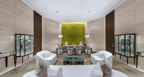 a kitchen with a table chairs sink and cabinets