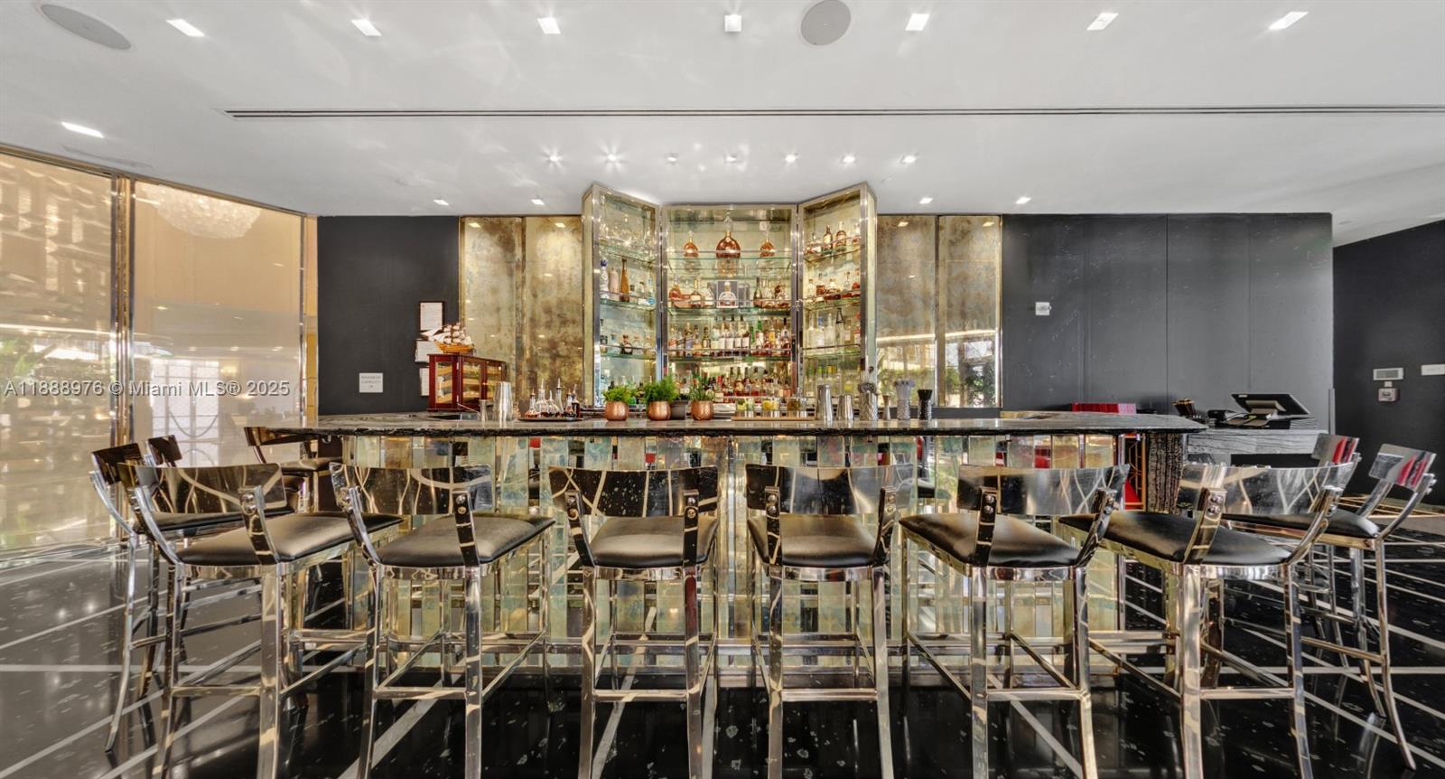 9703 Collins Avenue, Unit 600 Bal Harbour, FL 33154 - Photo 48 of 53 a bathroom with a large mirror and a shower