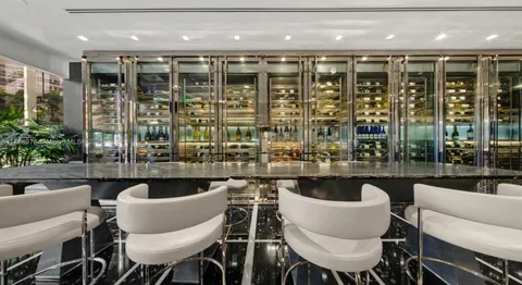 a view of a swimming pool with sitting area